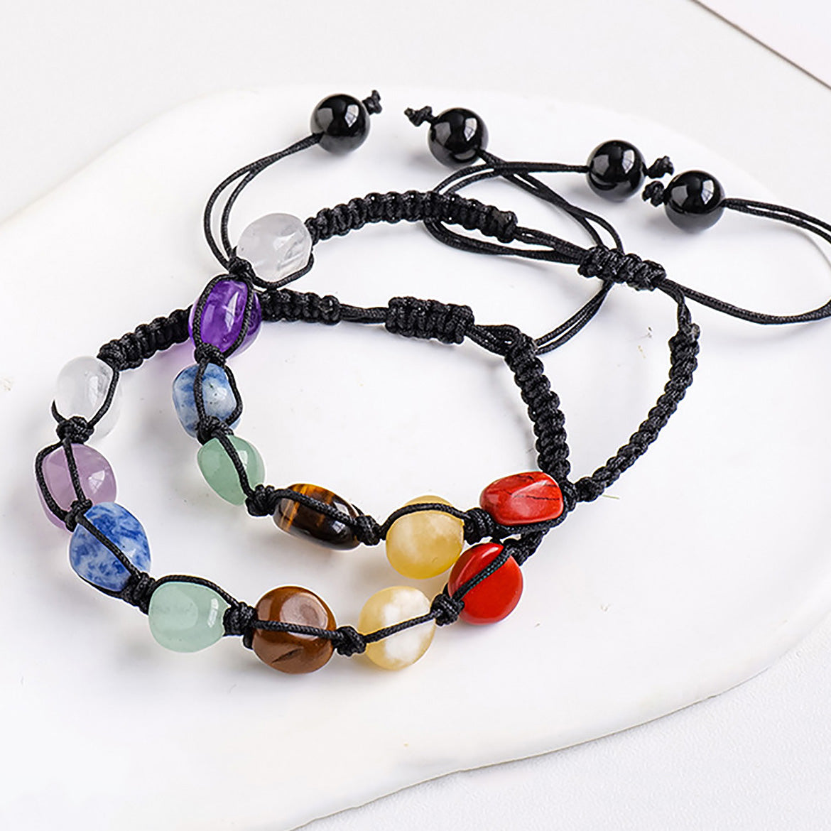 The bracelet is set with stones in a spectrum of vibrant colors, exuding a lively and stylish vibe.